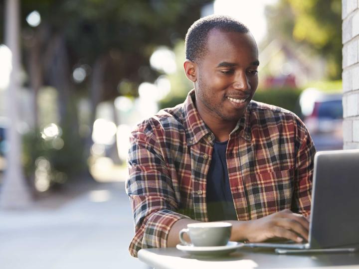 black man with laptop